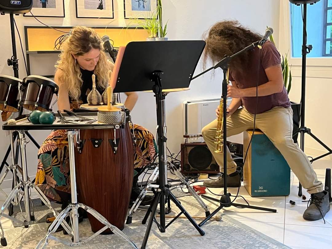 Afro Samba Duo performing at a house concert