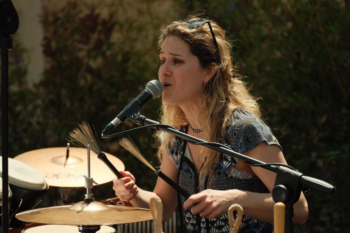 Benedetta Colasanto singing and playing percussion live