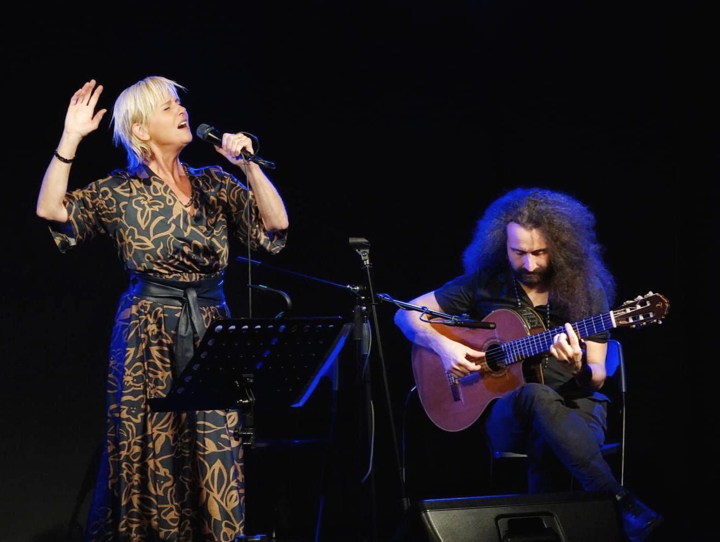 Singer and guitarist performing as a duo