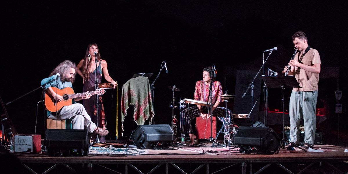 Balkalà performing with guests on stage