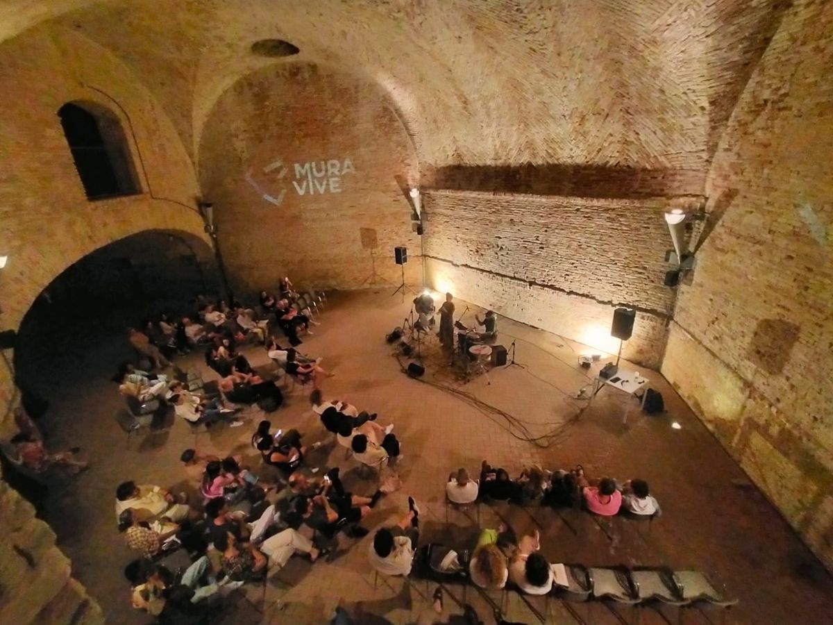 Concert audience in a stone hall