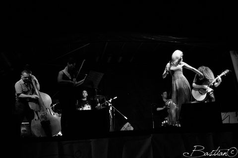 di.Ples performing on stage in black and white